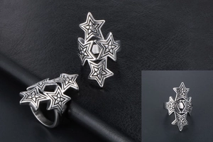 Close-up of vintage stacked pentagram star ring with a punk rock stainless steel finish