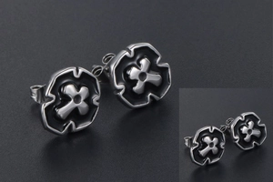 Detail view of silver stainless steel cross stud earring with black enamel and butterfly back