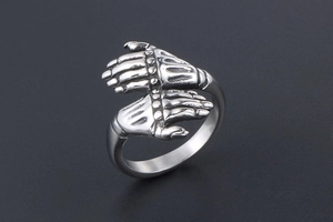 Detailed side view of vintage punk steel ring featuring dual skeleton hand armor design