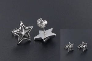 Detailed macro view of star stud earrings with radial texture and metal butterfly backs