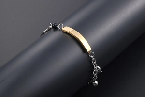 Polished gold curved plate on stainless steel chain with black bead and lobster clasp