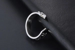 Detailed close-up of vintage engraved adjustable ring with pyramid studded texture