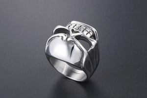 Detailed macro view of punk skull ring with silver finish and hollowed metal features