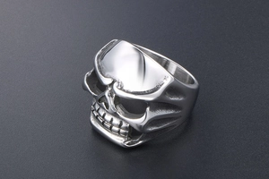 Close-up of a skull ring showing detailed stainless steel craftsmanship and punk style
