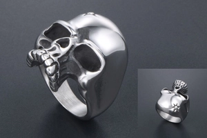 Macro view of polished stainless steel skull ring with intricate sunflower starburst details