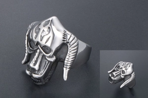 Macro shot of gothic titanium bull skull ring featuring vintage oxidized metal details
