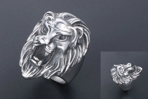 Detailed close-up of a roaring lion head ring featuring vintage punk steel textures