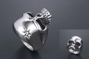 Detail view of gothic stainless steel skull ring featuring star pattern and matte finish
