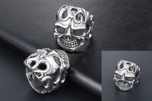 Close-up of vintage skull ring with detailed relief and blackened gothic finish