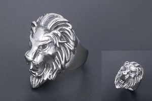 Detailed close-up of a silver lion head ring showing intricate mane and facial features