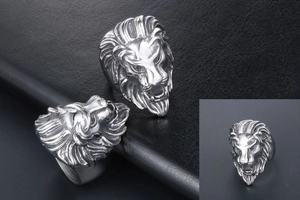 Detailed macro view of vintage lion head ring with antique silver finish on black leather