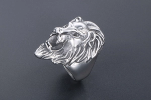 Detailed relief carving of a roaring lion head on a silver stainless steel ring