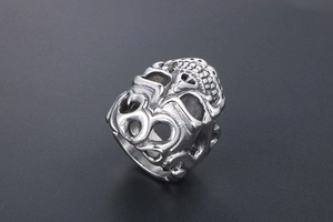 Macro shot of gothic skull ring detail with intricate vintage silver carvings