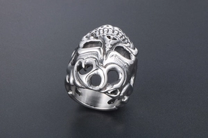 Macro shot showing intricate hollow carved skull details of a vintage punk steel ring