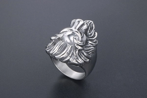 Macro side view of a punk lion head ring featuring detailed stainless steel relief