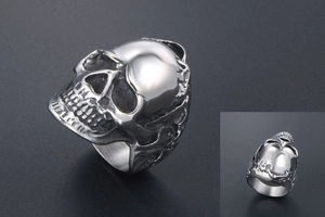 Macro close-up of a gothic skull ring in titanium steel featuring realistic bone texture