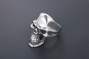 Detailed view of silver skull ring made of durable stainless steel in gothic biker style