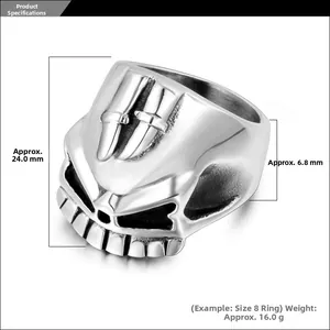 Detailed view of punk skull ring with embossed twin swords on a silver steel surface