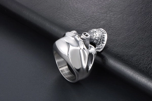Detailed macro view of vintage stainless steel skull ring with intricate sunflower carving