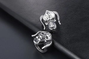 Macro view of vintage titanium steel bull horn monster ring with silver distressed finish