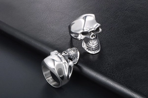 Close-up of gothic stainless steel skull ring with intricate facial details and polished finish
