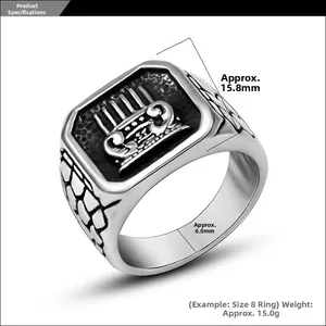 Detailed view of silver titanium steel ring with crown relief and textured band pattern