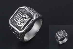 Macro shot of men's vintage titanium signet ring with engraved relief and brick textures
