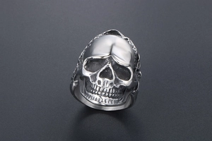 Macro shot showing detailed realistic skull design on polished stainless steel punk ring
