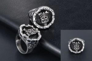 Macro shot of vintage skull crown rings showing the 925 hallmark and chain edge details