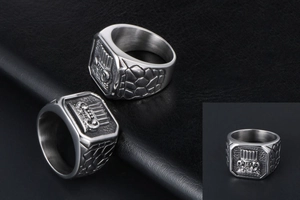 Macro view of vintage titanium steel ring with crown crest and stone texture detail