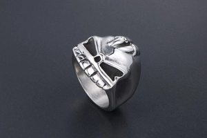 Macro view of gothic skull ring in silver stainless steel featuring embossed sword details
