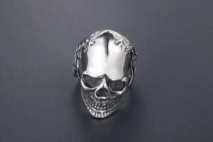 Detailed front view of silver skull ring with polished finish and intricate facial bone structure