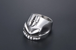 Macro detail of gothic skull ring with embossed cross swords in polished steel