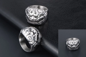 Detailed views of vintage stainless steel ring with mythical beast relief and brushed finish
