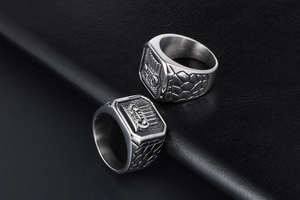 Detail of vintage signet ring for men with crown relief and textured stone pattern side