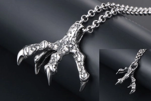 Macro detail showing textured dragon claw pendant with vintage silver punk finish