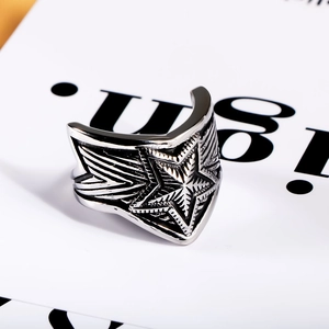 Detailed macro shot of vintage steel star ring with industrial punk texture and finish