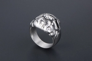 Detailed view of the matte titanium steel ring with an embossed mythical beast head
