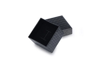 Quilted black jewelry gift box with velvet interior slot for rings and earrings
