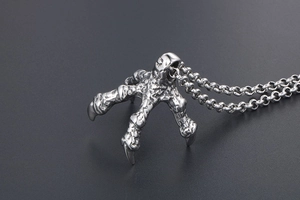 Detailed close-up of punk style dragon claw pendant with antique silver steel finish