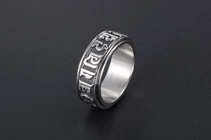 Detail of rotating inner band on vintage stainless steel ring with Sanskrit engraving