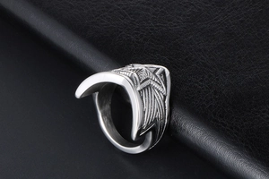 Detailed side view of vintage titanium steel wide star ring with punk relief textures