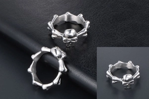 Detailed macro view of the punk skull ring with silver bone-link structure for men and women