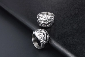 Close-up of vintage Kirin mythical beast ring with relief carving in silver stainless steel
