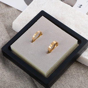 Minimalist gold titanium steel couple rings with love engraving in a premium gift box