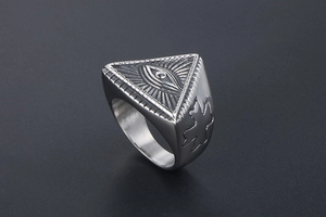 Close-up of vintage punk signet ring with engraved Eye of Providence and side cross