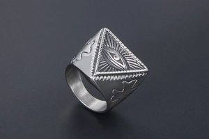 Detailed engraving of the Eye of Providence and cross on a punk steel ring for men