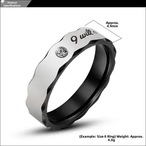 Detailed view of bicolor ring with I will engraving, 4.9mm width and wave edge