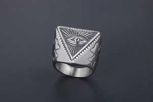 Macro detail of silver punk signet ring with engraved Eye of Providence and sunburst rays