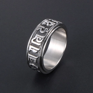 Rotating stainless steel mantra ring with silver brushed finish and embossed characters